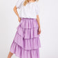 A model in the Mittoshop Chiffon Ruffle Layer Elastic Waist Midi Skirt from Zimonto, highlighting the skirt's layered ruffle design and comfortable fit, ideal for versatile styling. Explore this beautiful women's elastic waist skirt.