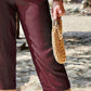 Close-up detail of Women's Pocketed Elastic Waist Capris in burgundy, featuring the premium fabric and chic pocket design.