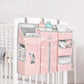 Sunveno Crib Organizer Baby Essentials Within Reach attached to a crib, showcasing a stylish pink design with room for diapers and baby toys, enhancing nursery decor.