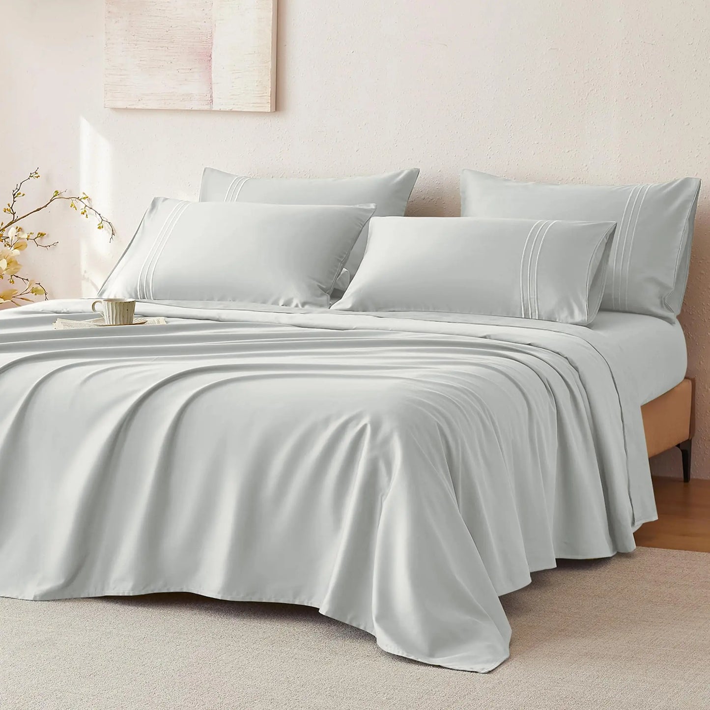 JELLYMONI Soft Cool Cotton Sateen Sheets in a soft gray color, featuring smooth comfort on a neatly made bed with coordinating pillows.