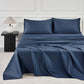 JELLYMONI Soft Cool Cotton Sateen Sheets in a rich navy blue color, artistically arranged on a stylish bed with matching pillowcases for a sophisticated sleep space.