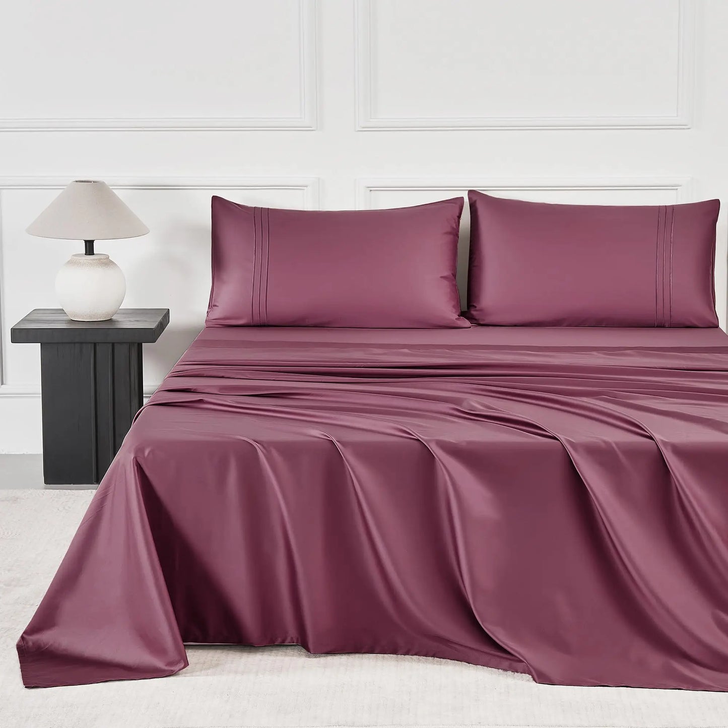 JELLYMONI Soft Cool Cotton Sateen Sheets in a rich burgundy hue, displayed on a stylish bed, emphasizing comfort and breathability.