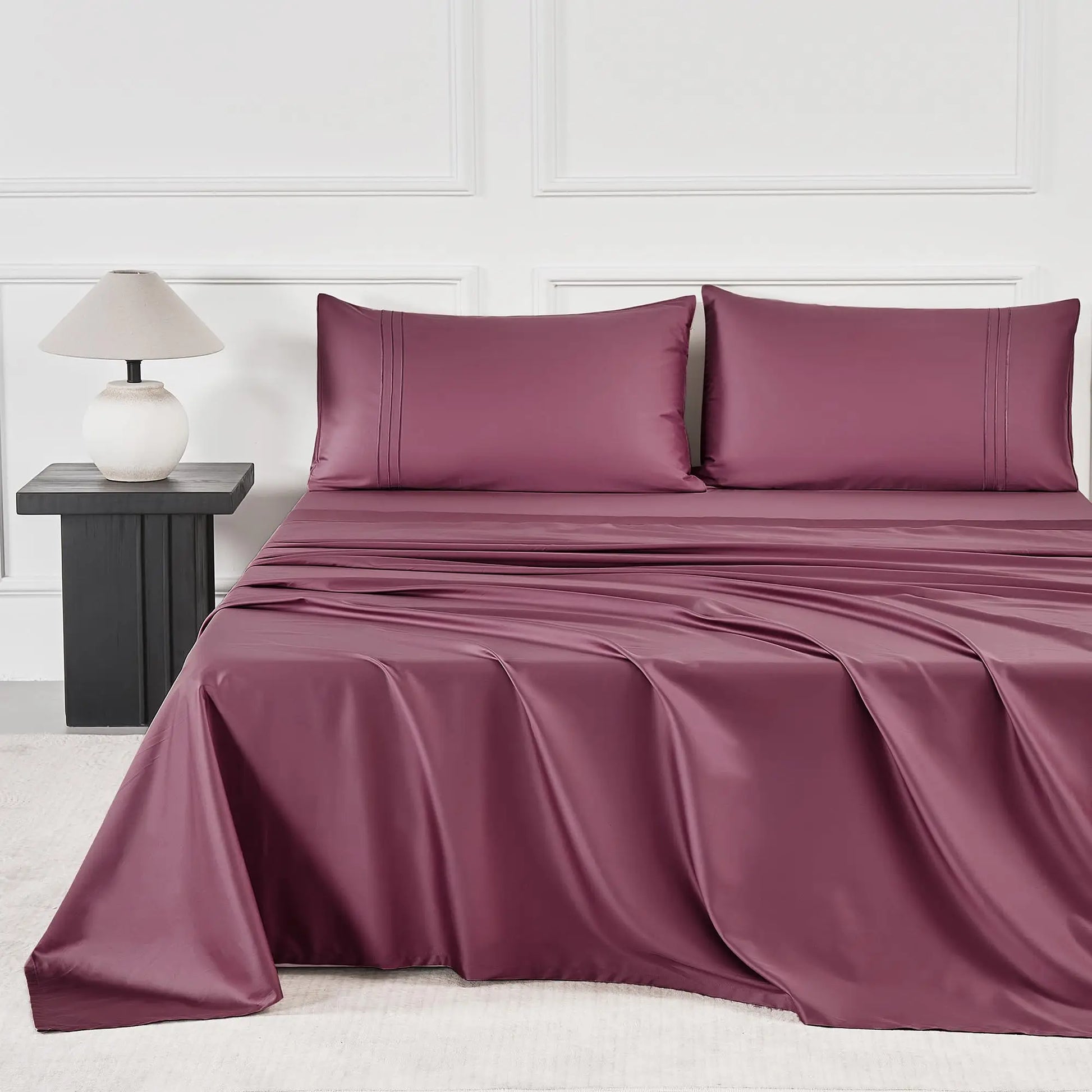 JELLYMONI Soft Cool Cotton Sateen Sheets in a rich burgundy hue, displayed on a stylish bed, emphasizing comfort and breathability.