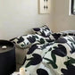 Colorful floral bedding detail showcasing Zimonto's INS Pink Bedding, enhancing the aesthetic of a cozy and stylish room.
