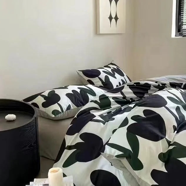 Colorful floral bedding detail showcasing Zimonto's INS Pink Bedding, enhancing the aesthetic of a cozy and stylish room.