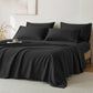 JELLYMONI Soft Cool Cotton Sateen Sheets displayed in an elegant black color, arranged on a bed with decorative pillows, perfect for a chic bedroom look.