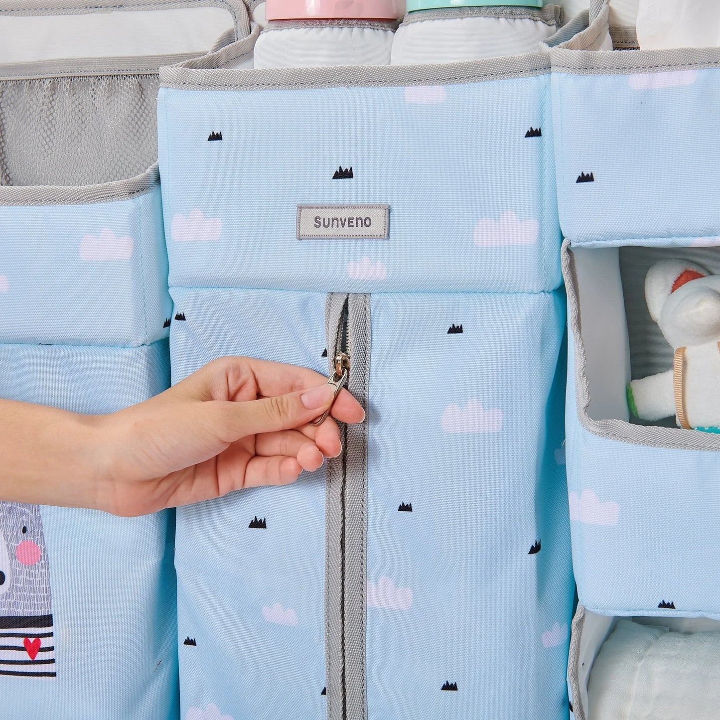 Sunveno Crib Organizer highlighting the easy access zipper compartment and colorful patterns for a chic nursery decor.