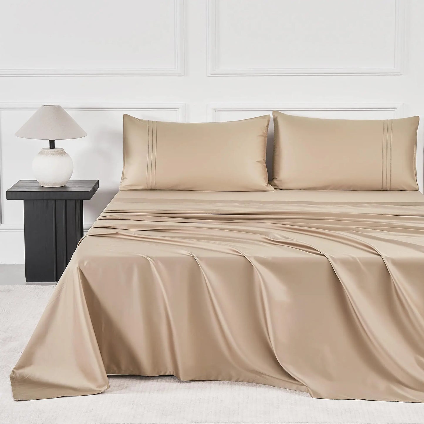 JELLYMONI Soft Cool Cotton Sateen Sheets in beige, artfully draped on a bed, illustrating the blend of style and comfort.