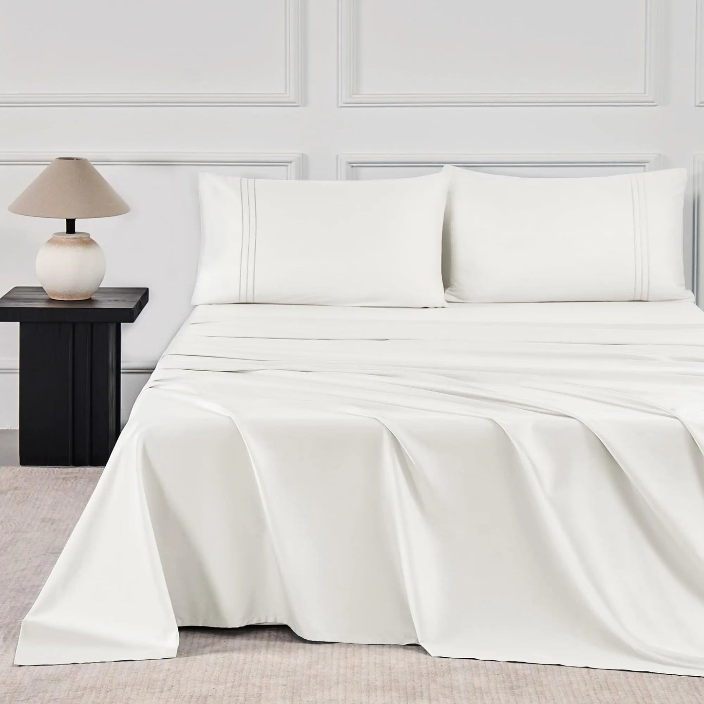 JELLYMONI Soft Cool Cotton Sateen Sheets in a crisp white color, elegantly styled on a modern bed with matching pillows, ideal for a fresh and clean bedroom aesthetic.