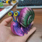 Articulated 3D printed snail toy in vibrant colors, perfect for collectors and kids