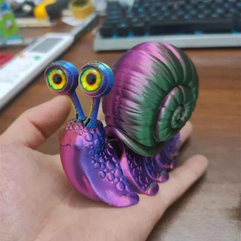 Colorful articulated 3D printed snail toy held in hand, showcasing its vibrant details