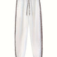 White jogger pants featuring a stylish leopard print hoodie jogger set with elastic cuffs