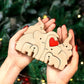 Personalized wooden elephant family sculpture held in hands, perfect for unique decor gifts