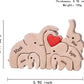 Personalized wooden elephant family sculpture with names engraved on each elephant and a heart detail