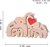Personalized wooden elephant family sculpture featuring names Mark, Lynn, Maia, and Sebby with a heart design