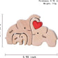 Personalized wooden elephant family sculpture featuring three elephants with custom names and a heart