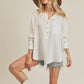 Zimonto - Aemi + Co Exposed Seam Raw Hem Half Button Top